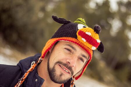 Young boy smiling in a funny hat. Photo taken in natureの写真素材