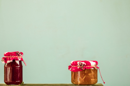 Jam cans on a blue background. Vintage conceptの写真素材