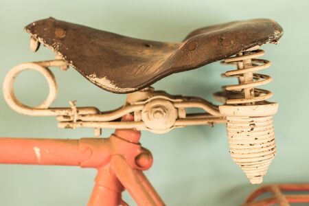 Parts of a vintage bike. Retro bike in pink color