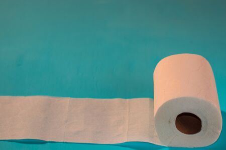 Toilet paper, on light blue backgroundの写真素材