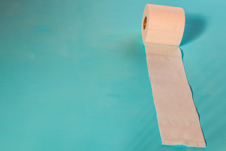 Toilet paper, on light blue backgroundの写真素材