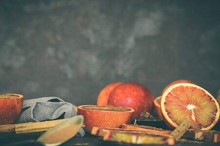Blood oranges, on dark and rustic background. Dark foodの写真素材