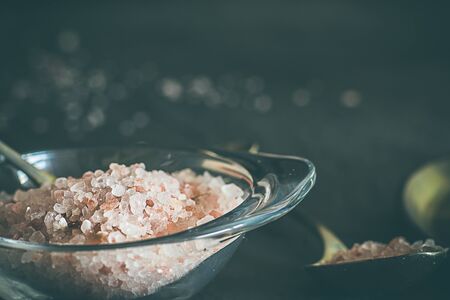 Himalayan pink salt, on a black background. Dark food conceptの写真素材