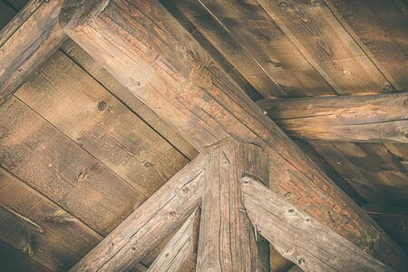 Parts of a wooden house made of logs. Detail of the constructionの写真素材