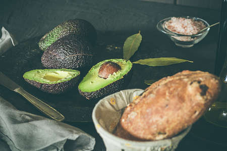 Avocados with bread and olive oil. Healthy food. Black foodの写真素材