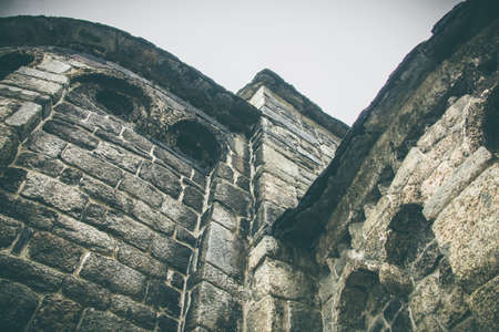 Parts of a brick wall of an ancient church. Grey and antique colorsの写真素材