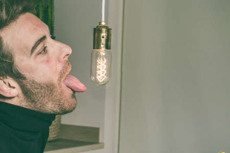 Funny picture of a blond kid with a light bulb. Fun Lifestyle