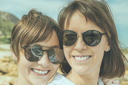 Two friends smiling and happy. Portrait of two young girls, concept of congratulations
