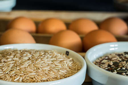 Wild brown rice in a bowl. And the bottom is chicken eggs. Healthy foodの写真素材
