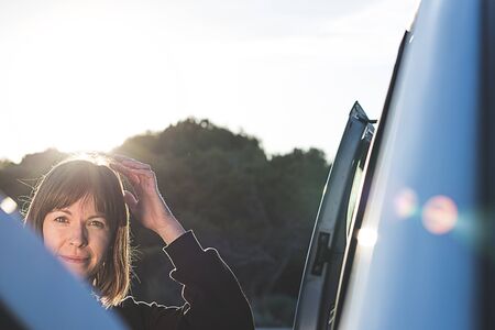 Girl scratching her head. Outdoor Photographyの写真素材