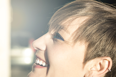 Sexy woman with short hair smiling. Close-up of a smiling girlの写真素材