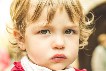 Close-up of a lovely child with pretty eyes and blonde hair