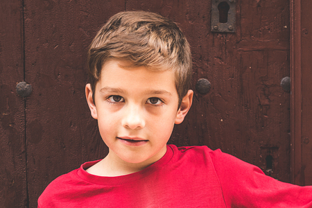 Portrait of a blond child with serious expressionの写真素材