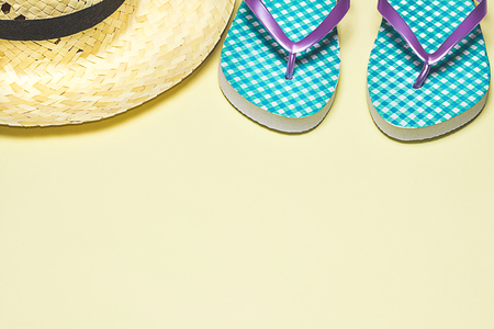 Summer items, flip-flops, sunglasses, hat. Summer concept, minimalist photoの写真素材