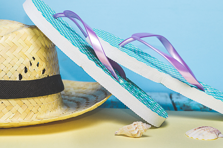 Summer items, flip-flops, sunglasses, hat. Summer concept, minimalist photoの写真素材