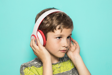 Kid with music helmets. Child with music headphonesの写真素材