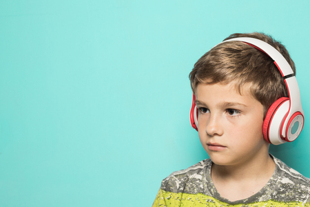 Kid with music helmets. Child with music headphonesの写真素材