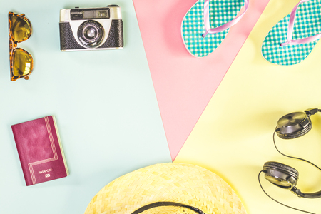 Summer accessories, flip-flops, camera, hat, sunglasses, music helmets, passport. Concept of tripsの写真素材