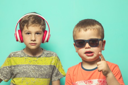 Children with music helmets and sunglasses. With a fun attitudeの写真素材