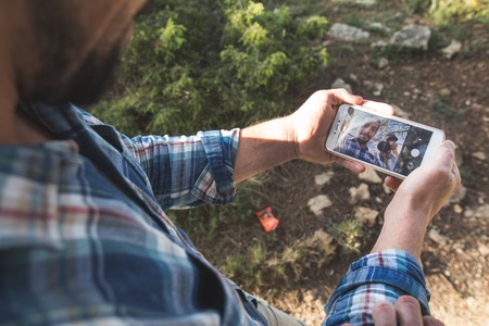 Man making a selfie in the mountains.Guy mountaineerの写真素材
