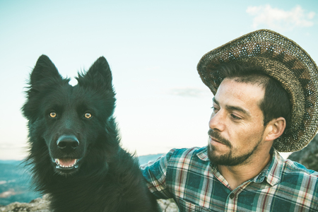 Portrait of a man and a dog. Guy and dogの写真素材