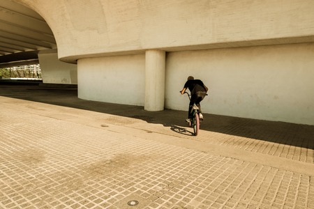 Guy riding a bmx bike. Extreme sports concept in the street