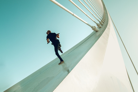 Young man doing street tricks with a bmx. Extreme urban sports conceptの写真素材