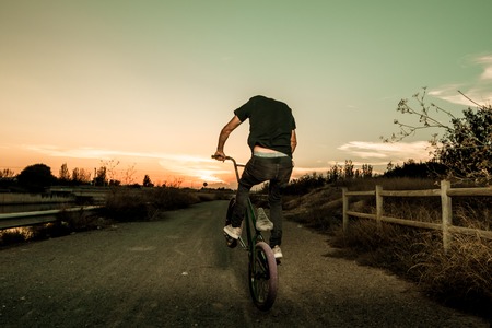 Portrait of a young man with a bmx bicycle. BMX riderの写真素材