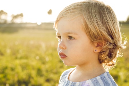 Portrait of a little blonde girl. Close-up of a lovely little girlの写真素材