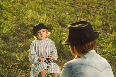 Mother and her little daughter playing in the field. Concept of love mother and daughterの写真素材