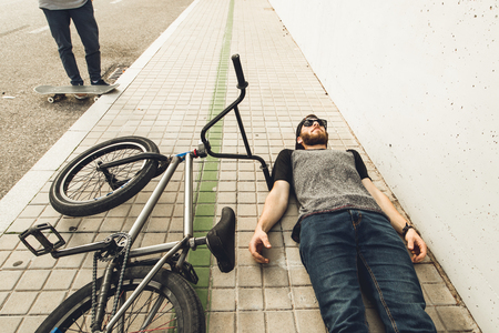 Young man with a bmx bike on the street. BMX riderの写真素材