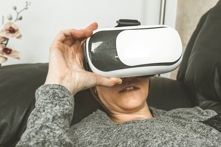 Close-up of a girl smiling with glasses Vr.Concept virtual reality glasses technologyの写真素材