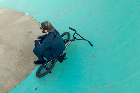 Young man with his bmx bike. Extreme urban sports conceptの写真素材