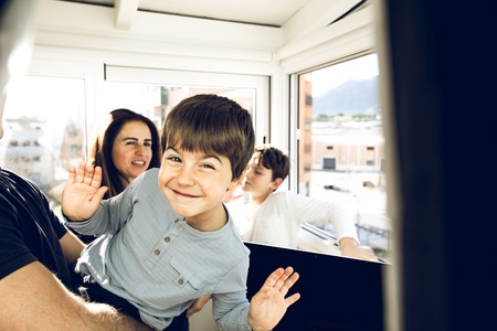 Portrait of a smiling and happy child at home. Kid with cheerful expressionの写真素材