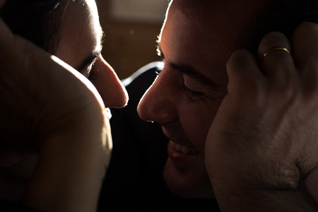 Portrait of a happy young couple looking into each other's eyes. Close-up of a man and a woman in...