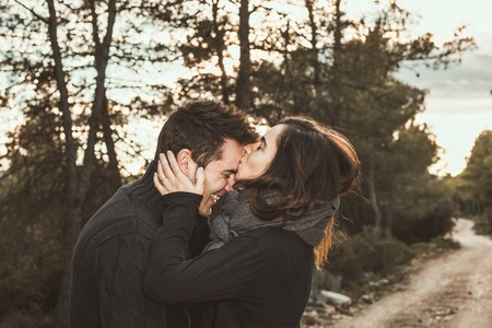 Portrait couple of guy and girl hugged and happy in the field. Photo style social networks and vintageの写真素材