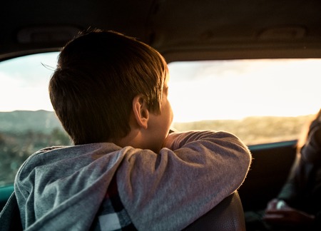 Portrait of a happy child in the carの写真素材