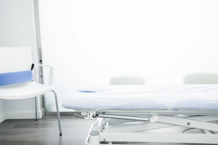 Room in a physiotherapy center with a massage table. Therapy concept and body healthの写真素材