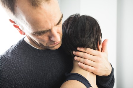 Close-up of a physiotherapist massaging the neck of a beautiful young woman. Concept physiotherapy and healthの写真素材