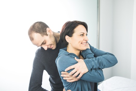 Physiotherapist massaging a woman lumbar. Concept of physiotherapy and osteopathy.