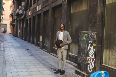 Elegant African-American man with sunglasses on the street. Black manの写真素材