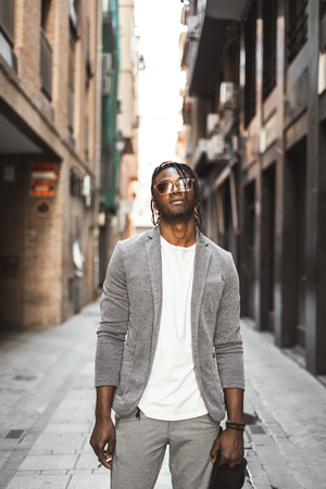 African-American man smoking a cigar in the street. Black man styleの写真素材