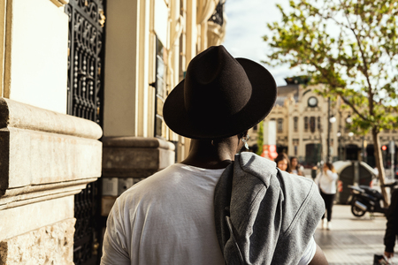 Guy with hat dressed in style and modern in the city. Black guyの写真素材