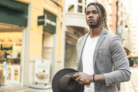 Portrait handsome african american guy on the street with serious expressionの写真素材