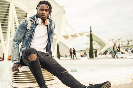 Outdoor portrait of a handsome young African with serious expressionの写真素材