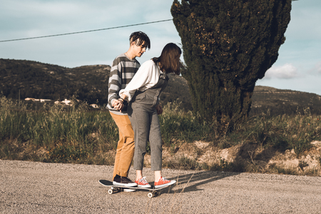Young people skateboarding and having fun. Skateboard coupleの写真素材