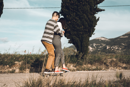 Young people skateboarding and having fun. Skateboard coupleの写真素材