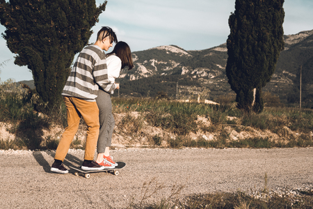 Young people skateboarding and having fun. Skateboard coupleの写真素材