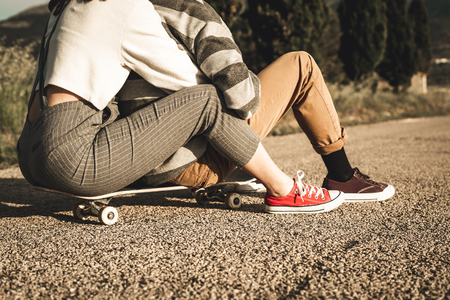 Young couple riding skateboarding having fun. Modern skateboarders millennial peopleの写真素材