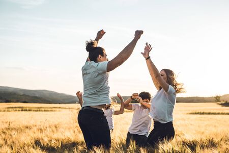 Happy and fun family in nature. Concept of united family having fun and smilingの写真素材